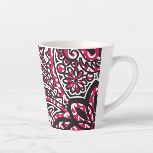 Ein dekoratives Paisley-Design mit lebhaftem Rot u Milchtasse