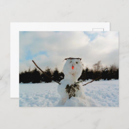 Ein echter Schneemann und ein winterliches Foto Feiertagspostkarte