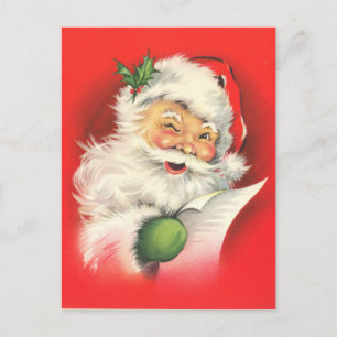 Ein fröhlicher zwinkerndder Weihnachtsmann liest s Postkarte