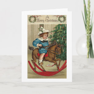 Ein fröhliches Weihnachtskind und Schaukelpferd Feiertagskarte