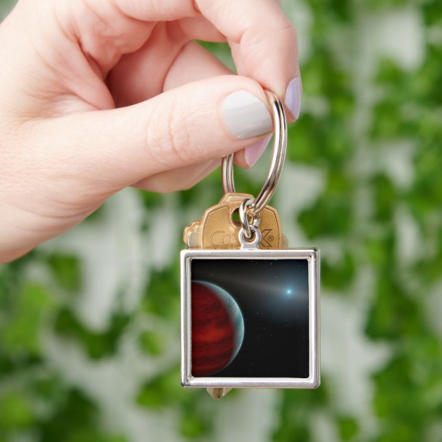 Ein Gasriese um einen weißen Zwergstern herum. Schlüsselanhänger (Hand)