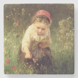 Ein junges Mädchen auf einem Gebiet Steinuntersetzer