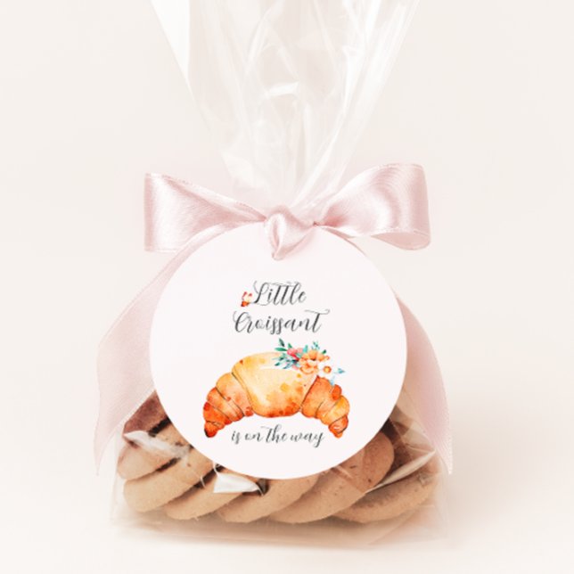 Ein kleines Croissant ist unterwegs mit einer Baby Geschenkanhänger (Von Creator hochgeladen)