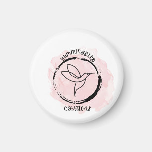 Ein Kolibridesign für ein Logo auf einem Schlüssel Magnet