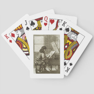 Ein Künstler, der auf eine Stichplatte, gedruckt Spielkarten