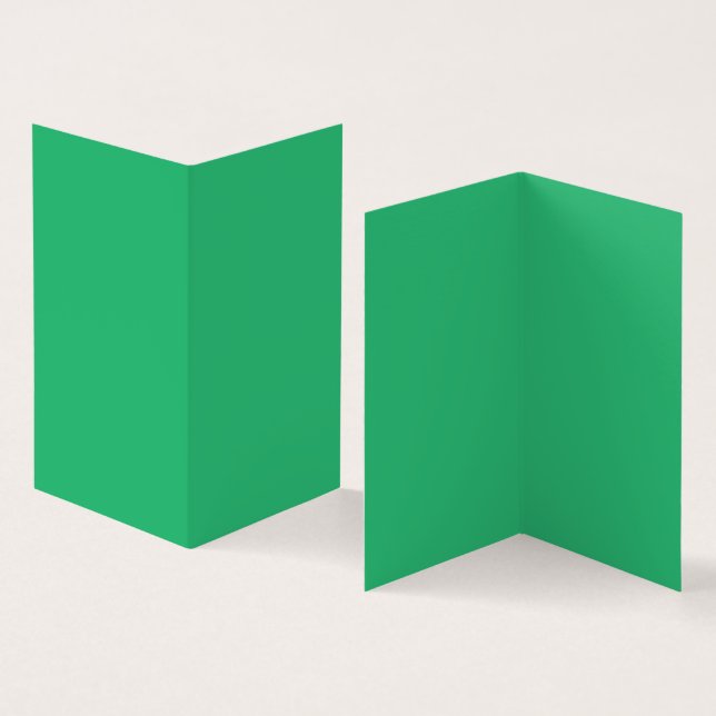 Ein lebendiges grünes Blatt mit prominenten Venen  (Innenseite und Außenseite)