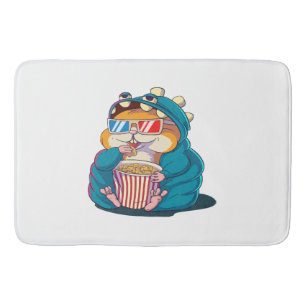 Ein lustiger Hamster mit Brille isst Popcorn Badematte