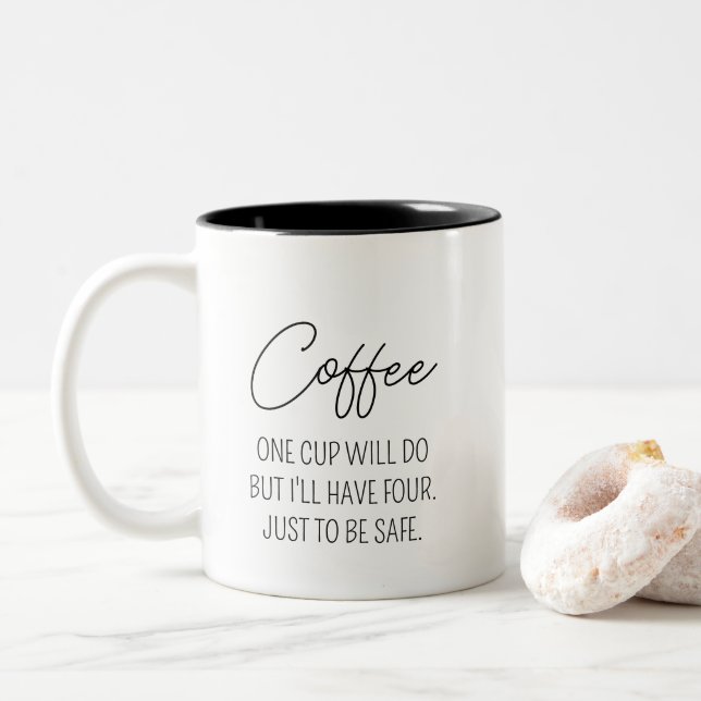 Ein lustiges Kaffeekonzept hat vier davon, um sich Zweifarbige Tasse (Mit Donut)