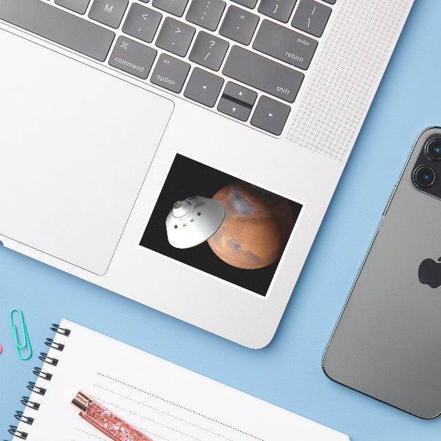 Ein mit Aeroshell angereichertes Raumfahrzeug nähe Aufkleber (Laptop mit iPhone)