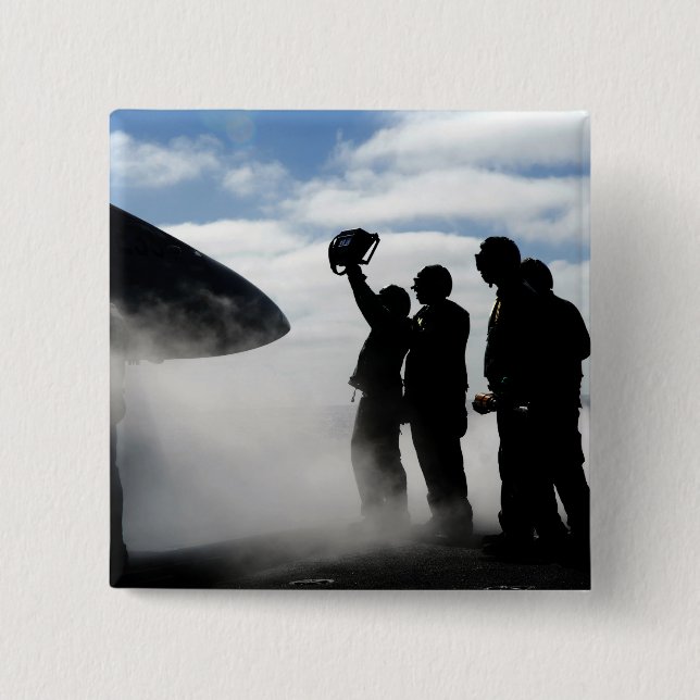 Ein Mitglied der Crew eines Cockpits Button (Vorderseite)