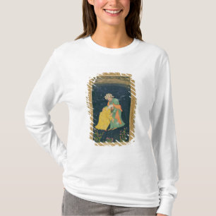 Ein Mulla, der unten zu einem Mann im iranischen T-Shirt