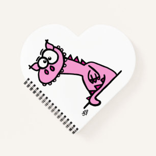 Ein niedlicher Drache in rosa Notizbuch