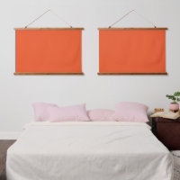 Ein orangefarbenes Quadrat mit weißem Rand, das ei