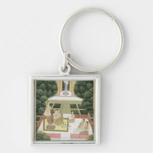 Ein Paar in einem Garten, der Musik mit femal hör Schlüsselanhänger