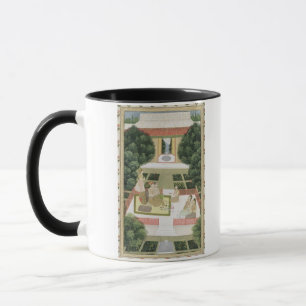 Ein Paar in einem Garten, der Musik mit femal hör Tasse