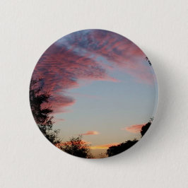 ein rosa, blauer und lila Sonnenaufgang Button