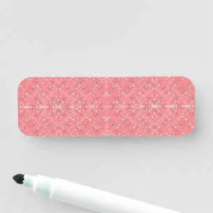 ein rosa Hintergrund mit einem Muster in der Mitte Namensschild