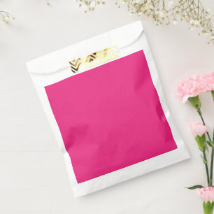ein rosa Hintergrund mit schwarz Geschenktütchen