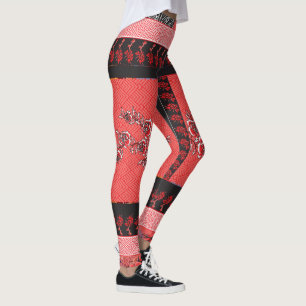 ein rotes und schwarzes Muster mit Blume darauf Leggings