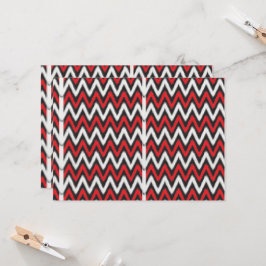 ein rotes und schwarzes Zickzackmuster auf weißem Einladung