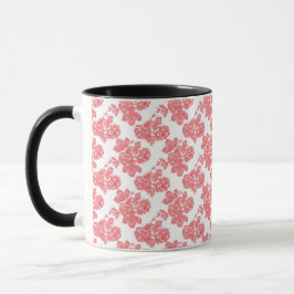 Ein rotes und weißes Blume-Muster auf einem weißen Tasse
