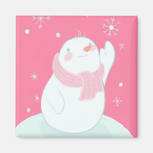 Ein Schneemann, der nach einer fallenden Schneeflo Magnet