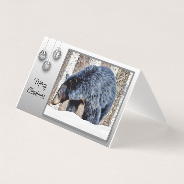 Ein schöner schwarzer Bär im Schnee. (Vorderseite)