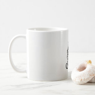 ein Schwarz-Weiß-Bild eines aufwendigen Designs Kaffeetasse