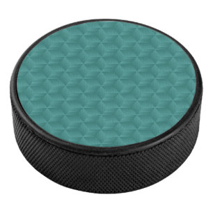 Ein Türkis geometrisches Muster ziert die Oberseit Eishockey Puck