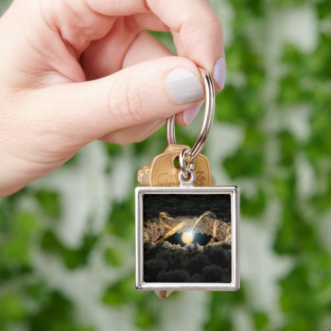 Ein von einer protoplanetären Diskette umgebener S Schlüsselanhänger (Hand)