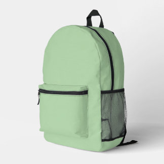 Ein weicher, blassgrüner Hintergrund füllt das Bil Bedruckter Rucksack