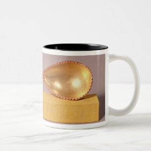 Ein zeremonieller Löffel Zweifarbige Tasse