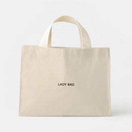 Eine beigefarbene Tote Bag mit weißen Griffen  Mini Stoffbeutel