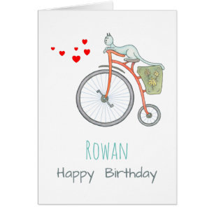 Eine blaue Katze auf einem Vintagen roten Fahrrad