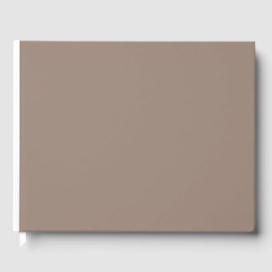 eine braune Mauer mit Gästebuch