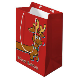 Eine Dackel mit einem Weihnachtshut Mittlere Geschenktüte