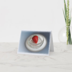 Eine Erdbeere in einer Tasse Karte