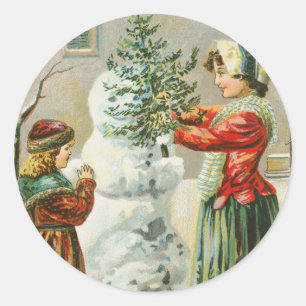 Eine fröhliche Weihnachtsfrau, Kind und Schneemann Runder Aufkleber