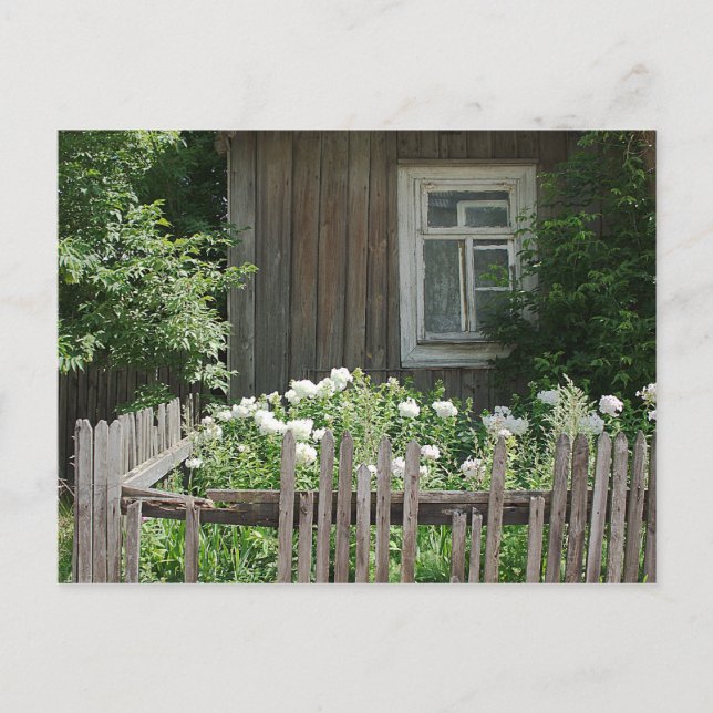 Eine Holzhütte mit Postkarte (Vorderseite)