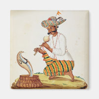 Eine indische Schlange Charmer mit einer Kobra aus