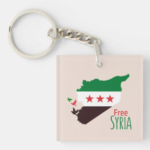 Eine Karte Syriens mit der "Revolution Flag" Schlüsselanhänger