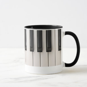 Eine musikalische Illustration einer Klaviertastat Tasse