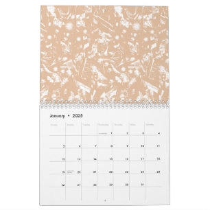 Eine Nahaufnahme einer strukturierten Wand mit Pat Kalender