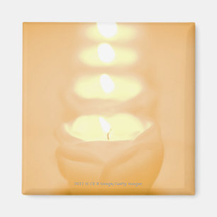 Eine Reihe der beleuchteten Kerzen Magnet