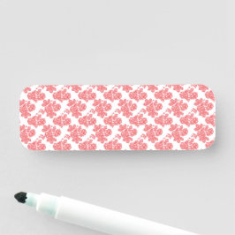 eine rote und weiße Blume auf weißem Hintergrund Namensschild