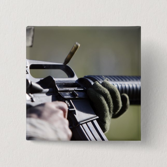 Eine Rundfliege aus der Kammer eines M-16A2 Button (Vorderseite)