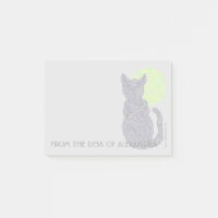 Eine schwarze Katze und ein Mond vom Schreibtisch