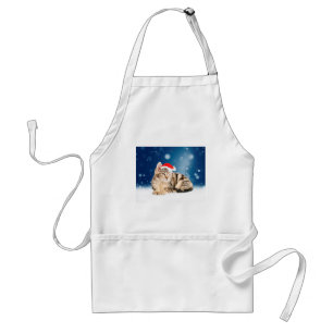 Eine süße Katze mit roter Santa-Mütze Weihnachten Schürze