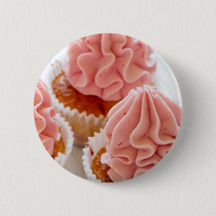 Eine süße Leckerei Cupcake mit rosa Zuckerguss Button