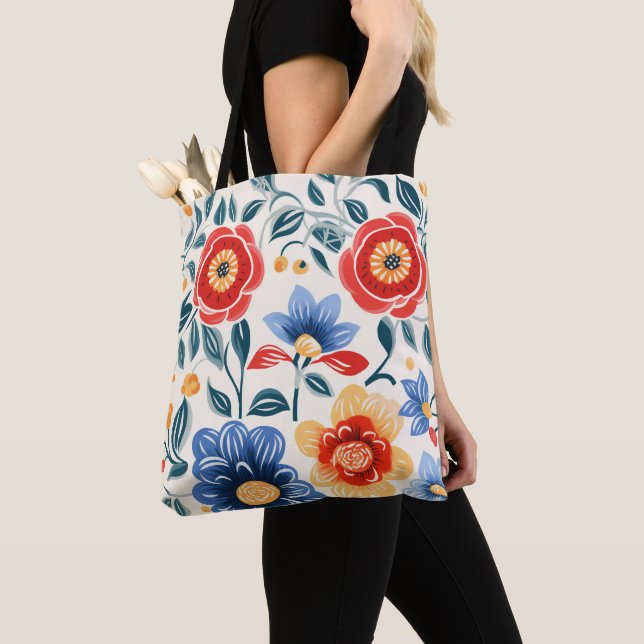 Eine Tasche mit schwarzen Griffen zeigt ein farben (Von Nahem)